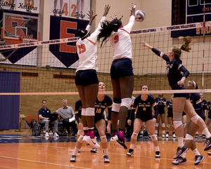 Christina Oyawale (9) rises up for a block against Notre Dame on Friday night in the Women's Building.